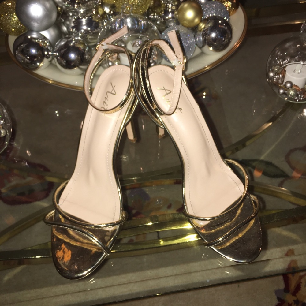Gold high heels